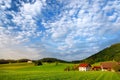 Breathtaking lansdcape of Austrian countryside on sunset. Dramatic sky over idyllic green fields of Anstrian Central Alps on autum Royalty Free Stock Photo