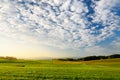 Breathtaking lansdcape of Austrian countryside on sunset. Dramatic sky over idyllic green fields of Anstrian Central Alps on autum