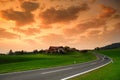 Breathtaking lansdcape of Austrian countryside on sunset. Dramatic sky over idyllic green fields of Anstrian Central Alps on autum Royalty Free Stock Photo