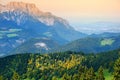 Breathtaking lansdcape of mountains, forests and small Bavarian villages in the distance. Scenic view of Bavarian Alps with majest