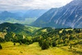 Breathtaking lansdcape of mountains, forests and small Bavarian villages in the distance. Scenic view of Bavarian Alps with majest