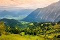 Breathtaking lansdcape of mountains, forests and small Bavarian villages in the distance. Scenic view of Bavarian Alps with majest