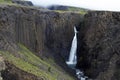 Breathtaking Litlanesfoss waterfall at east of Iceland. Waterfall is framed by basalt columns