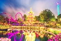 Breathtaking magical landscape in Tivoli Gardens in the evening with rides in the illuminations. Copenhagen, Denmark. Exotic