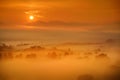 Breathtaking morning lansdcape of small bavarian village covered in fog. Scenic view of Bavarian Alps at sunrise with majestic mou Royalty Free Stock Photo