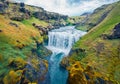 Breathtaking morning scene of waterfall on Skoga river