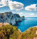 Breathtaking morning view of Cape Lefkatas with old lighthouse. Sunny spring seascape of Ionian Sea. Beautiful outdoor scene of