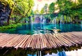Breathtaking morning view of Plitvice National Park. Colorful spring sunrise in green forest with pure water waterfall. Great