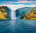 Breathtaking morning view of Skogafoss Waterfall. Fabulous summer landscape of Skoga river. Spectacular. outdoor scene of Iceland,