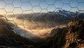 Breathtaking Mountain Landscape Viewed Through a Creative Modern Hexagonal Mirror Mosaic Tile Pattern Reflecting Sunrise Light Royalty Free Stock Photo