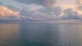 Breathtaking ocean sunrise panoramic drone view. Sunlight shining through clouds