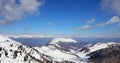 Breathtaking panorama of the Alps mountain range in winter with snow-capped peaks without people with blue sky Royalty Free Stock Photo