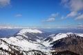 Breathtaking panorama of the Alps mountain range in winter with snow-capped peaks without people with blue sky Royalty Free Stock Photo