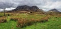 Breathtaking panorama of the mountains in Glencoe at rain, Scotland Royalty Free Stock Photo