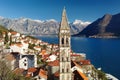 Breathtaking panoramic aerial drone view of ancient city of Perast, Montenegro. Old medieval little town with red roofs and with