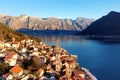 Breathtaking panoramic sunset aerial drone view of the ancient city of Perast, Montenegro. Old medieval little town with red roofs