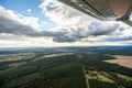 Skyline Horizon - Panoramic View from a Plane Window with Clouds and Fields Royalty Free Stock Photo