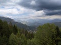 Dark storm clouds over endless layers of Pyrenees mountains