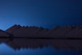 Breathtaking scenery of hills reflecting in the ocean during nighttime in Salt, Bonaire, Caribbean Royalty Free Stock Photo