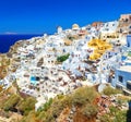 Breathtaking scenery of Oia village traditional Greek island architecture at Aegean sea and noon zenith sun flare Royalty Free Stock Photo