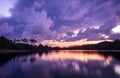 Breathtaking scenery of the sunset clouds reflecting in Lac du Jaunay, France