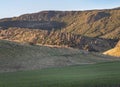 The breathtaking scenic landscape of Holyrood park with Salisbury Crags rugged hills and sky background