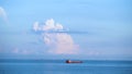 Breathtaking seascpe with a sailing red barge on blue cloudy sky on the background, water transport concept. Shot. Cargo Royalty Free Stock Photo