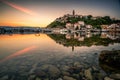 Breathtaking shot of a bay illuminated by buildings at sunrise in Moscenicka Draga, Istria, Croatia