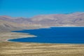 Breathtaking shot of an emerald colored lake in the middle of Tibetan plateau. Royalty Free Stock Photo