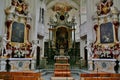 Breathtaking shot of the main altar of the church with antique statues on Mainau island in Germany