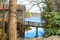 a breathtaking shot of the old wooden grist water mill at Stone Mountain Park with vast blue lake water Royalty Free Stock Photo