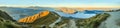 Breathtaking, Stunning Panoramic Landscape View from Roys Peak on Lake Wanaka with golden sunshine light at twilight, South Island