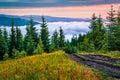 Breathtaking summer scene of Carpathian mountains. Few minutes before sunrise, fog wraping mountain valley. Lisniv ridge, Ukraione