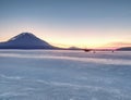 Breathtaking sunset with blue pink clouds over frozen lake Royalty Free Stock Photo