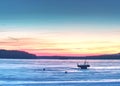 Breathtaking sunset with blue pink clouds over frozen lake Royalty Free Stock Photo