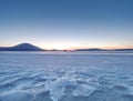 Breathtaking sunset with blue pink clouds over frozen lake Royalty Free Stock Photo