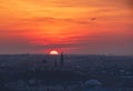 Breathtaking sunset over Lviv city, Ukraine. The aircraft takeoff over the horizon