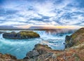 Breathtaking sunset scene of powerful Godafoss waterfall. Dramatic sky over Godafoss Royalty Free Stock Photo