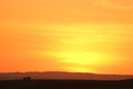 Breathtaking sunset sky over the sand dune of Huacachina desert with the silhouette of dune buggy and tourists Royalty Free Stock Photo