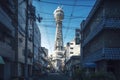 Breathtaking urban landscape of the Tsutenkaku Tower in Osaka, Japan in blue colours