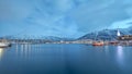 Breathtaking view from the Arctic Ocean of the Tromso harbor on blue cloudy sky background