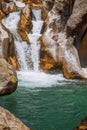 Breathtaking view of beautiful waterfall of the mountain river. Sapadere canyon, Turkey. Summer vacation, rest, wild nature