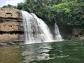 Breathtaking View of Borhill Waterfalls Cascading Down the Rocky Terrain Amidst Lush Greenery