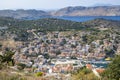 Breathtaking View of Colorful Houses and Port of Symi Below, the Blue Aegean Sea and the Mountains Beyond Royalty Free Stock Photo