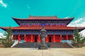 Breathtaking view of king`s palace of Medicine Buddha old temple in Jingpo lake geopark with azure sky