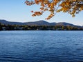 Lake Placid seen from across the lake with fall colors and clear blue sky Royalty Free Stock Photo