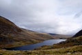 Breathtaking view of a lake surrounded by hills in National Trust, Carneddau and Glyderau Pont, UK