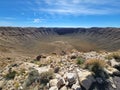 Stunning view of a mountainous landscape featuring rugged rock formations: Meteor crater in Arizona