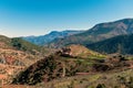 Breathtaking view of Morocco\'s Atlas Mountains with terraced fields and rustic homes Royalty Free Stock Photo