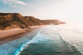 Breathtaking view of the ocean and the rocky cliffs under the beautiful bright sky Royalty Free Stock Photo